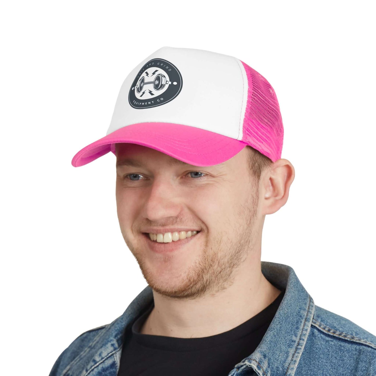 Man wearing vibrant pink and white Grip and Grind trucker hat, ideal for workouts and sunny days.