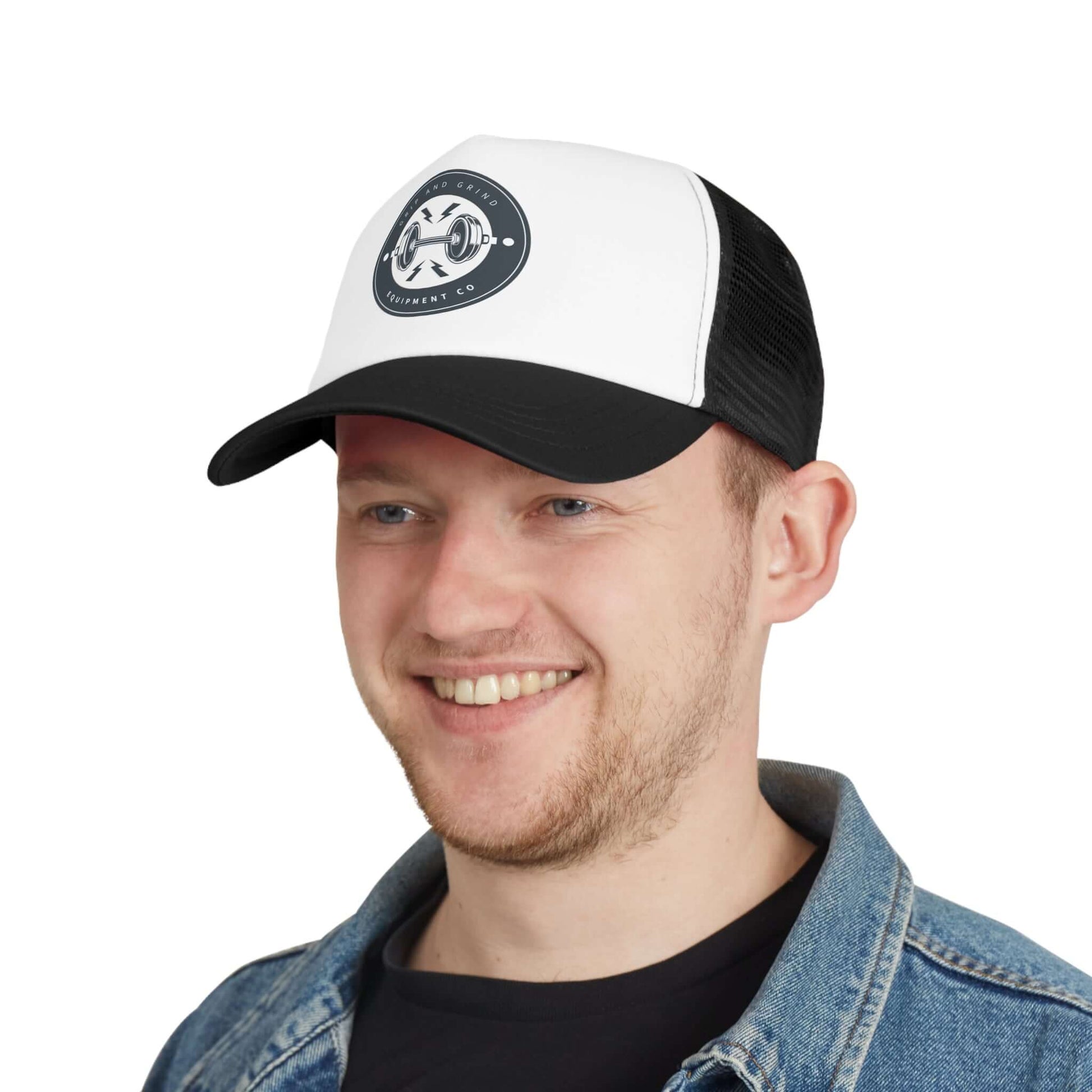 Man wearing Grip and Grind Trucker Hat, featuring a fitness logo, perfect for workouts and outdoor activities.